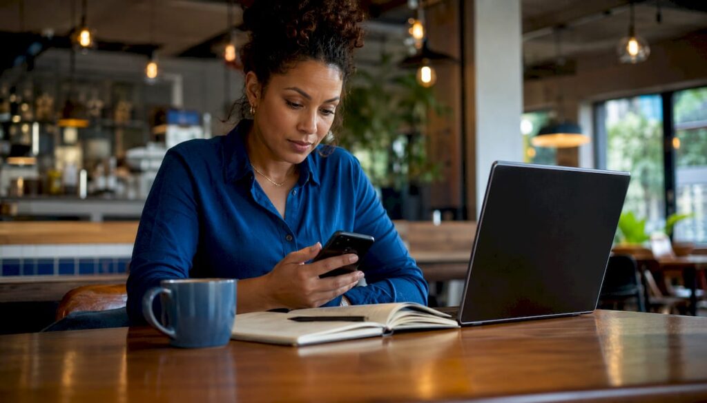 Woman managing personal data removal at home desk