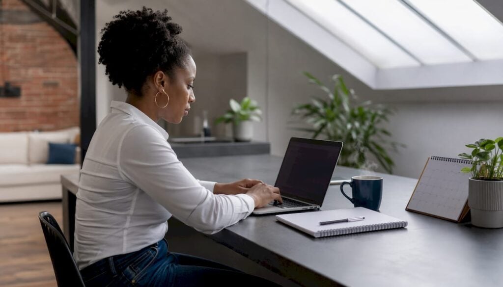 Content creator securing digital files on laptop
